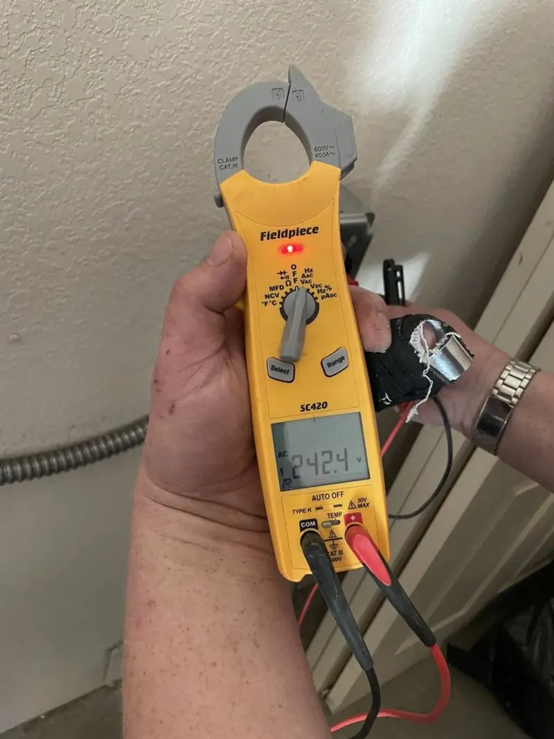 Voltage testing with clamp meter during Electrical Installation Services in Lenoir City